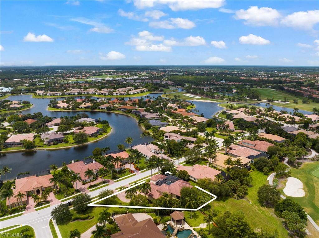 7834 Classics Drive Naples, FL 34113 - Photo 36 of 37 an aerial view of residential houses with outdoor space