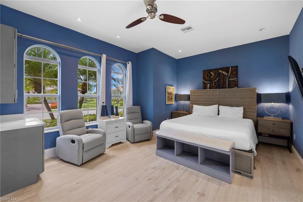 7834 Classics Drive Naples, FL 34113 - Photo 7 of 37 a spacious bedroom with a bed and a large window