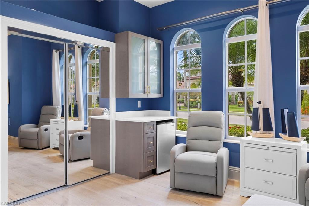 7834 Classics Drive Naples, FL 34113 - Photo 10 of 37 a living room with furniture and entry gate