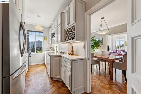 a kitchen with a sink a stove and a microwave