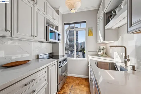 a kitchen with a sink and cabinets