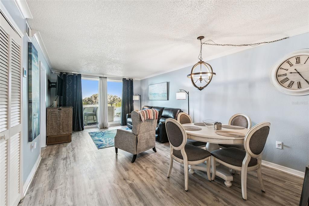 5915 Sea Ranch Drive, Unit 108 Hudson, FL 34667 - Photo 14 of 92 a view of a dining room with furniture window and wooden floor