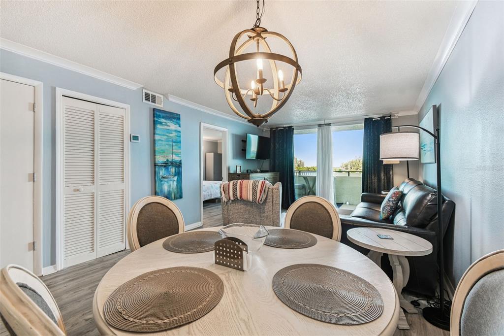 5915 Sea Ranch Drive, Unit 108 Hudson, FL 34667 - Photo 15 of 92 a living room with furniture a mirror and a large window