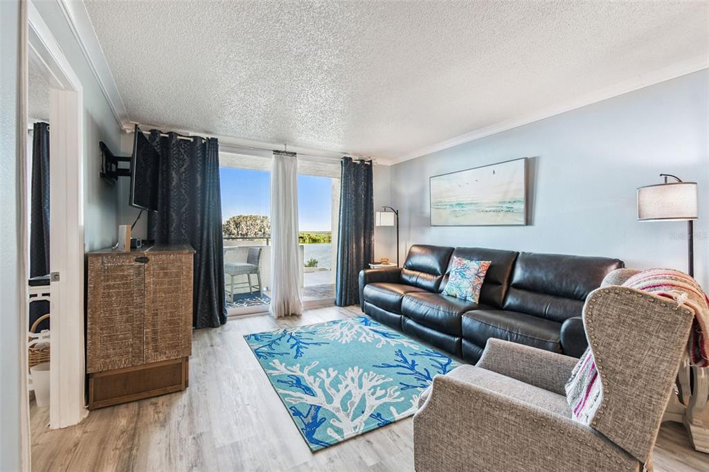 5915 Sea Ranch Drive, Unit 108 Hudson, FL 34667 - Photo 18 of 92 a living room with furniture and a rug