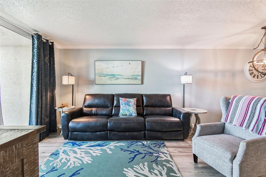 5915 Sea Ranch Drive, Unit 108 Hudson, FL 34667 - Photo 19 of 92 a living room with furniture and a window