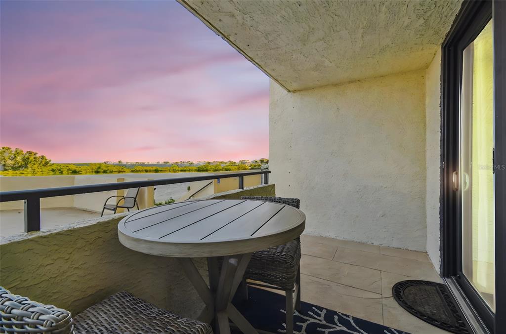 5915 Sea Ranch Drive, Unit 108 Hudson, FL 34667 - Photo 2 of 92 a view of a balcony furniture and stove