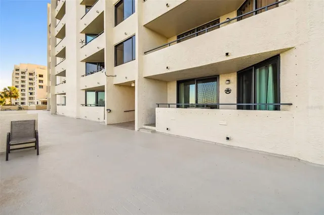 a bathroom with a granite countertop sink a toilet and mirror