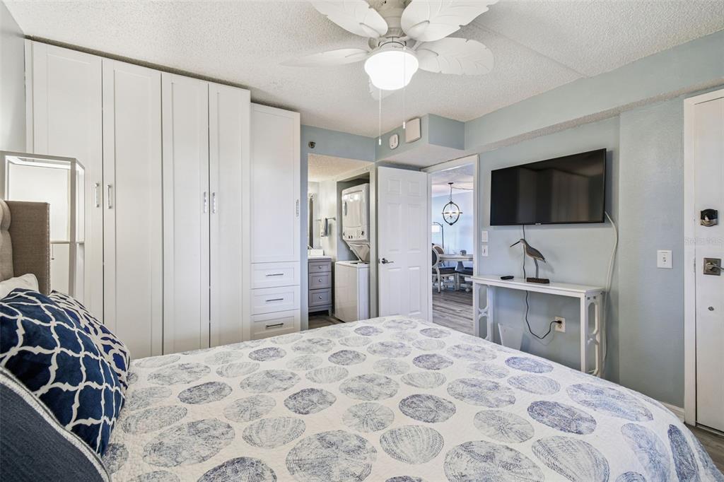 5915 Sea Ranch Drive, Unit 108 Hudson, FL 34667 - Photo 35 of 92 a bedroom with a bed and a flat screen tv in it