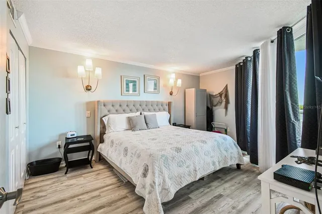 a living room with furniture a rug and a window