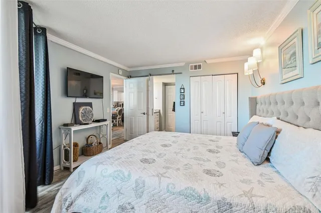 a living room with a couch and a book shelf