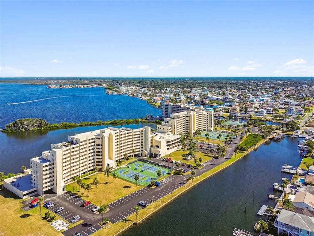 5915 Sea Ranch Drive, Unit 108 Hudson, FL 34667 - Photo 85 of 92 an aerial view of residential houses with outdoor space