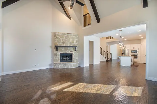 wooden floor with a fireplace in living room