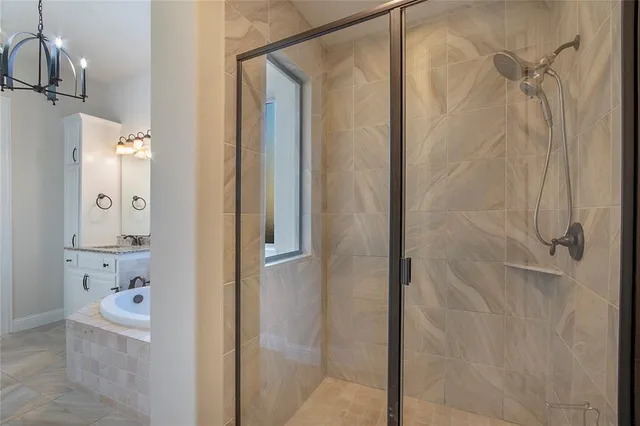 a bathroom with a bathtub and shower