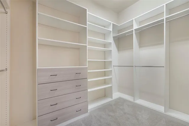 a view of an empty walk in closet