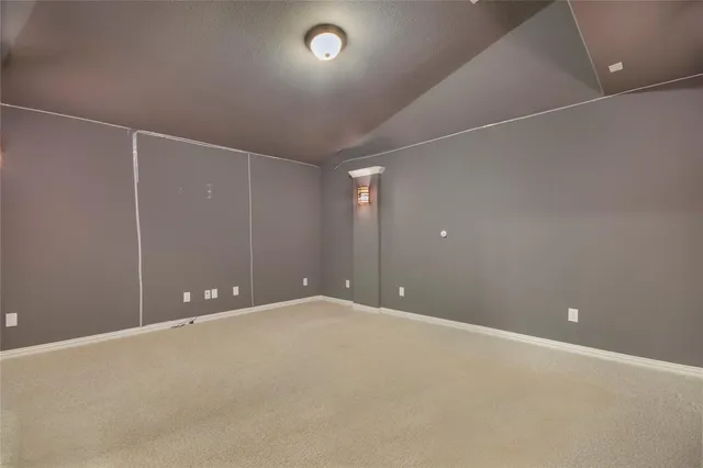 a bedroom with a large bed and a potted plant