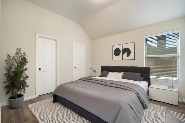 an empty room with a window and a ceiling fan