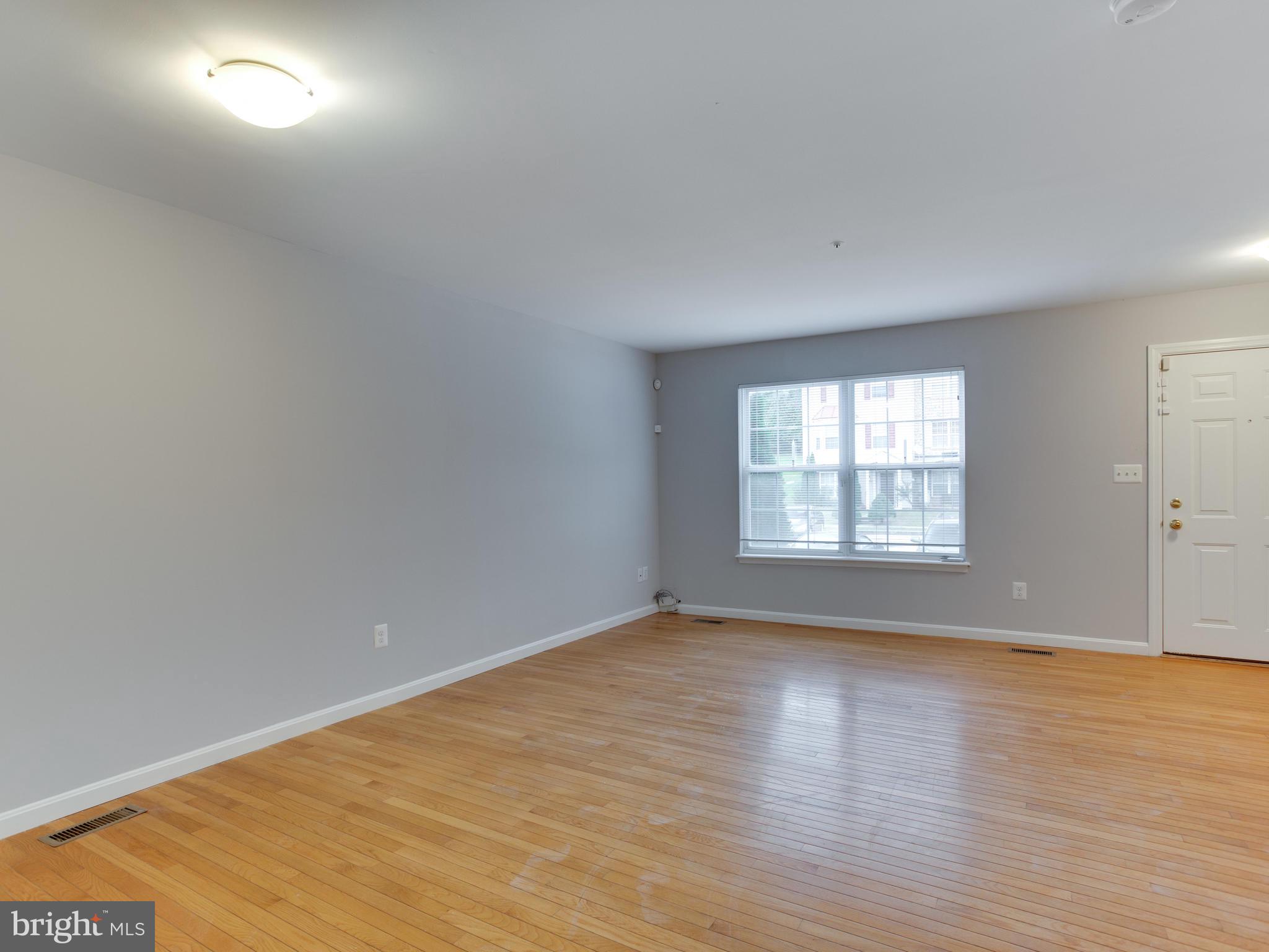8723 Jarwood Road Baltimore, MD 21237 - Photo 13 of 43 Living room has a lot of natural light.