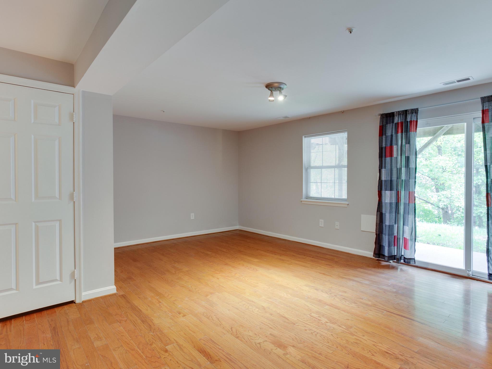 8723 Jarwood Road Baltimore, MD 21237 - Photo 28 of 43 Finished basement with sliding door