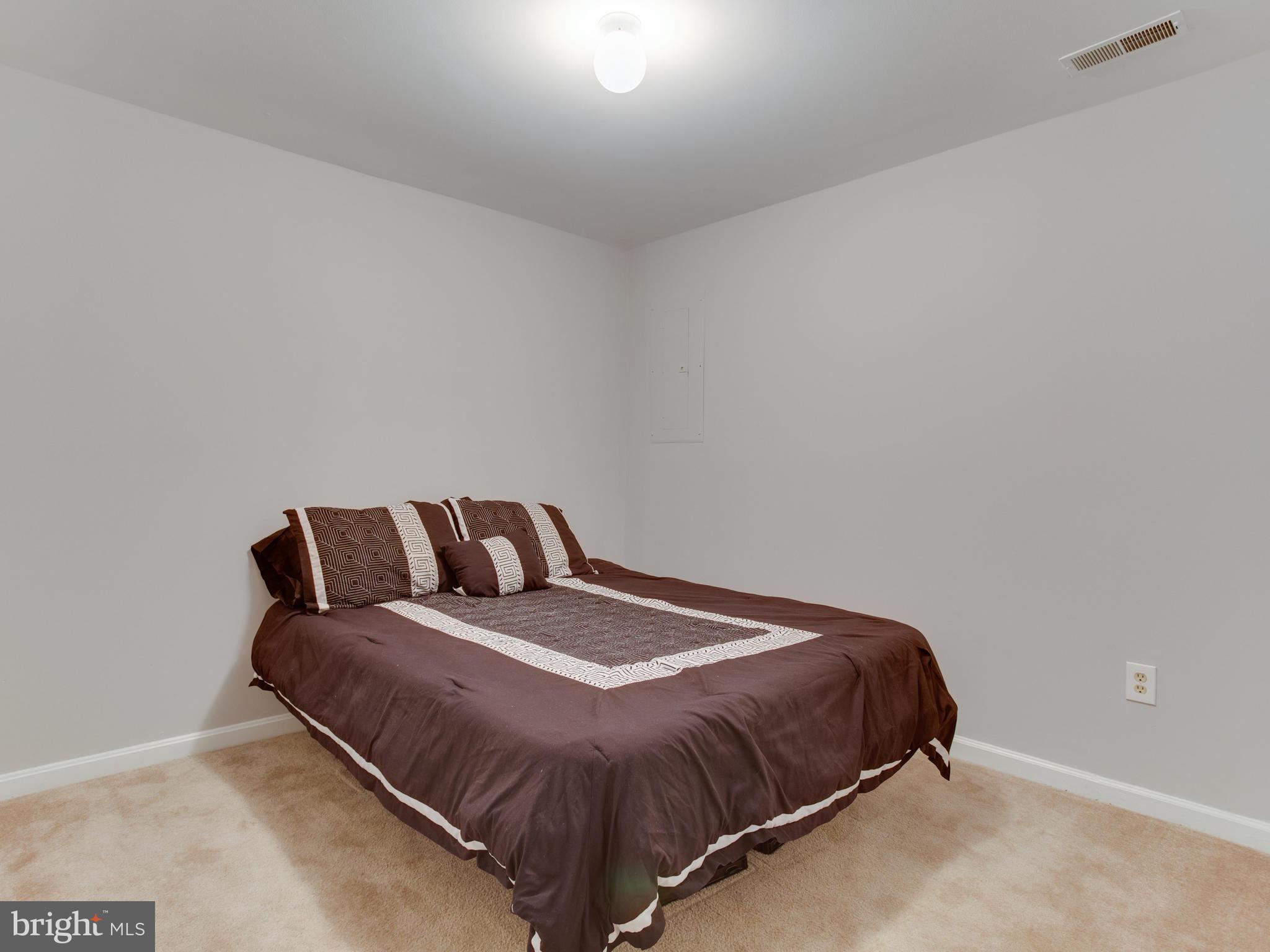 8723 Jarwood Road Baltimore, MD 21237 - Photo 29 of 43 Lower level bedroom