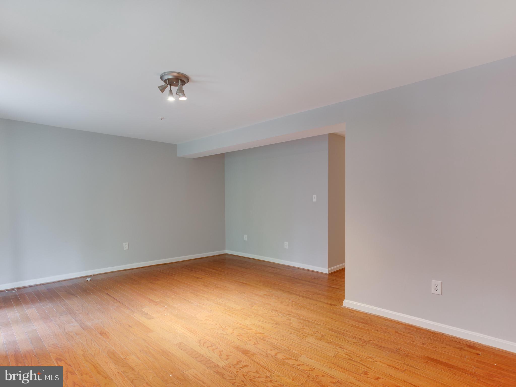 8723 Jarwood Road Baltimore, MD 21237 - Photo 33 of 43 Finished basement with hardwood floors