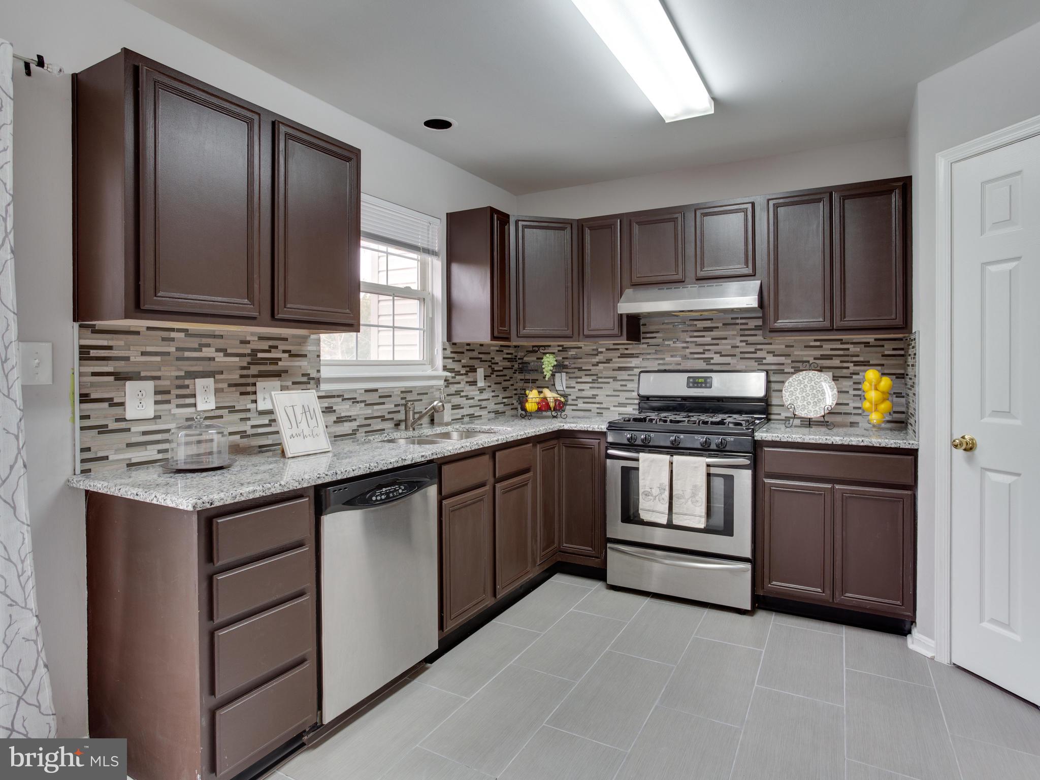 8723 Jarwood Road Baltimore, MD 21237 - Photo 5 of 43 New Kitchen with new counter top and floor.