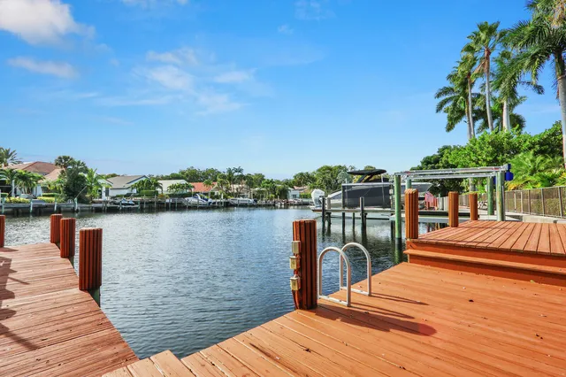 a view of a house with pool and sitting area