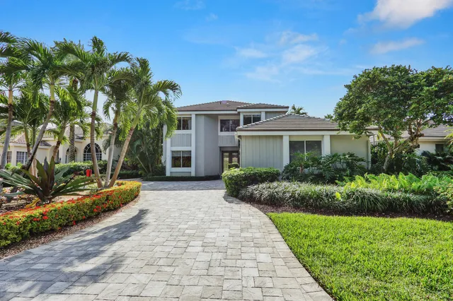 a view of a lake with boats and trees in the background