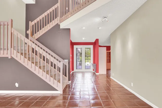 a view of an entryway with a front door