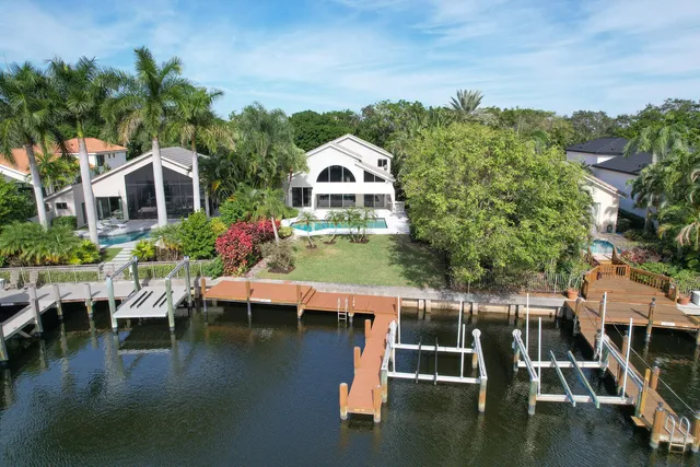 a view of a house with a yard patio and sitting area