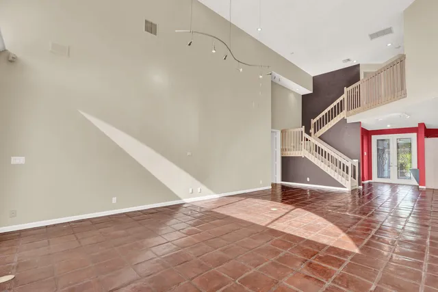 a view of an empty room with stairs