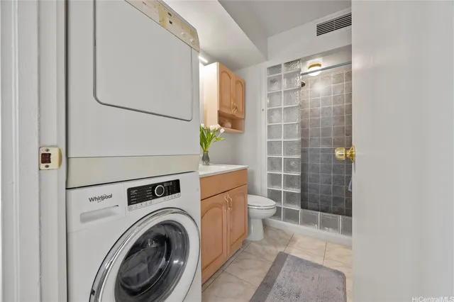 a bathroom with a shower a toilet and sink