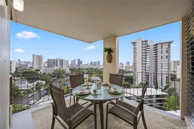 a view of a balcony with chair and potted plants