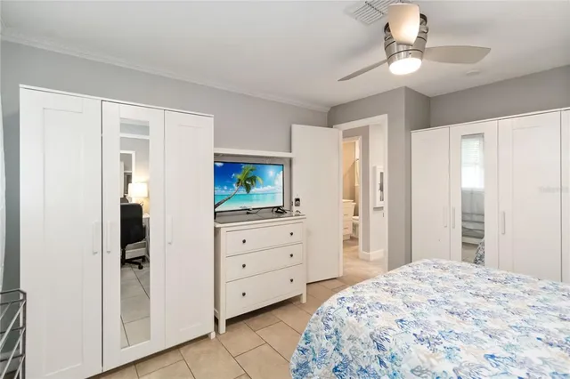 a bedroom with a bed and a dresser