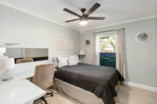 a bedroom with a large bed and a window