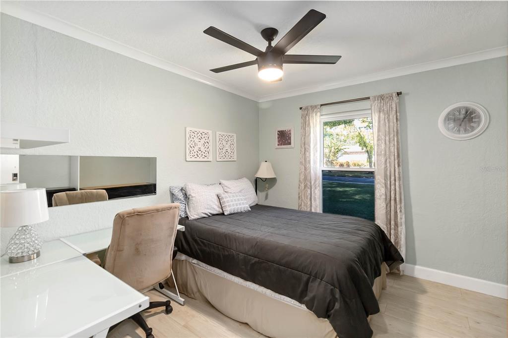 395 Piney Ridge Road Casselberry, FL 32707 - Photo 13 of 34 a bedroom with a large bed and a window