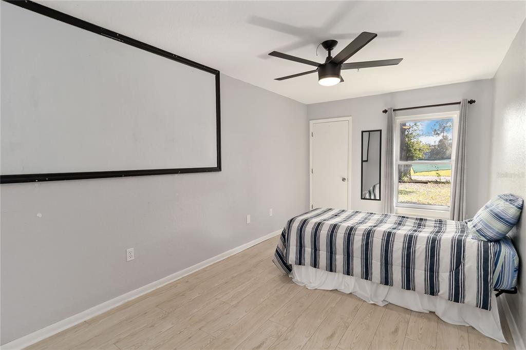 395 Piney Ridge Road Casselberry, FL 32707 - Photo 18 of 34 a bedroom with a bed and a window