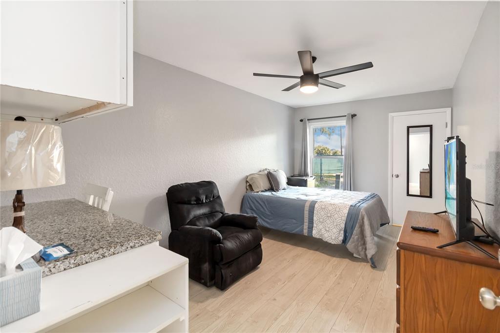 395 Piney Ridge Road Casselberry, FL 32707 - Photo 19 of 34 a bedroom with furniture and a window