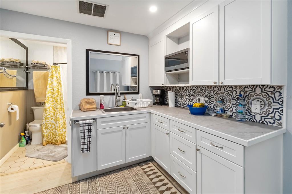 395 Piney Ridge Road Casselberry, FL 32707 - Photo 28 of 34 a spacious bathroom with a double vanity sink mirror and