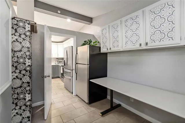 a kitchen with stainless steel appliances a refrigerator and a sink