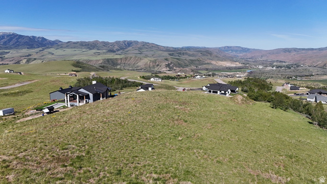 1398 Mogul Lane, Unit 1 Inkom, ID 83245 - Photo 13 of 33 Modern property situated on a hillside with a dark gray exterior and a white covered patio