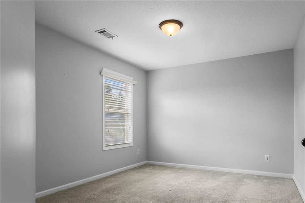 6 Pebblebrook Lane Fort Mitchell, AL 36856 - Photo 28 of 48 Carpeted spare room with baseboards and a textured ceiling