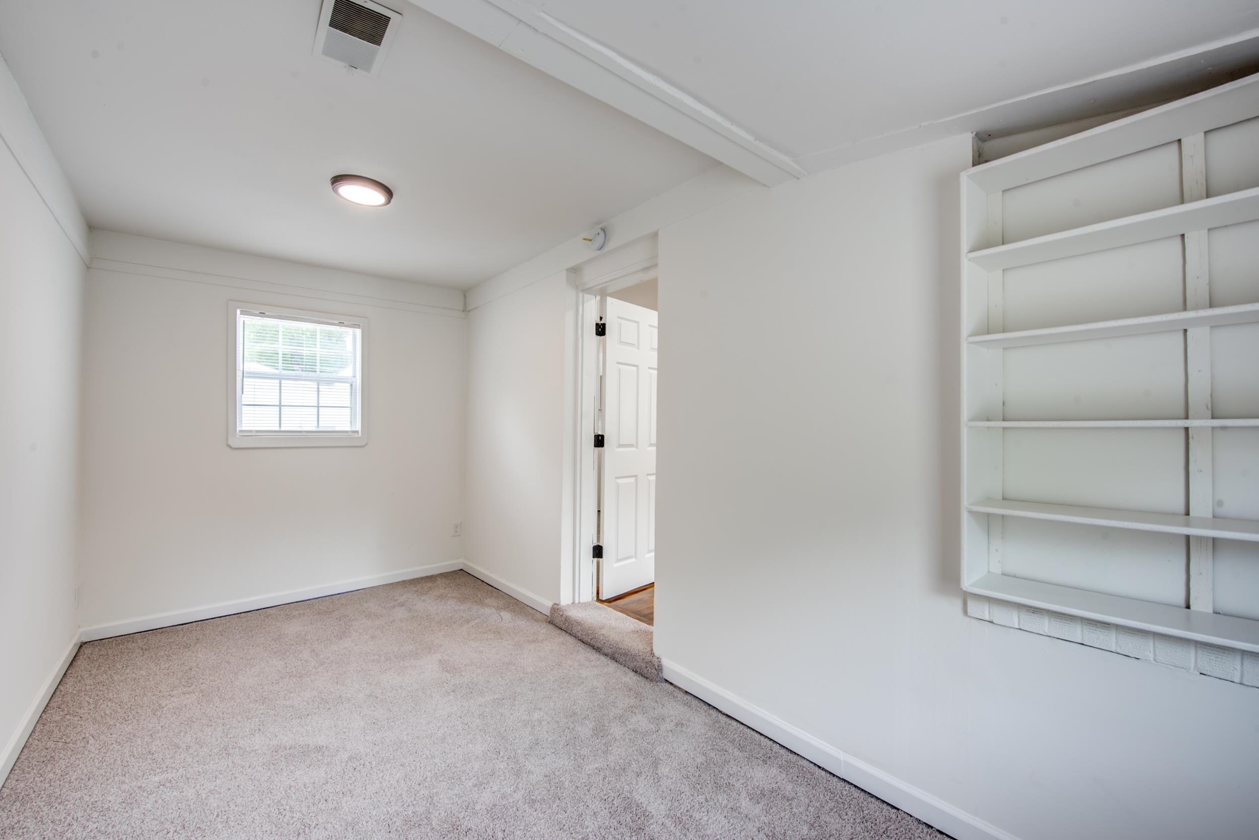 1334 South Perkins Road Memphis, TN 38117 - Photo 20 of 21 a view of an empty room with a window