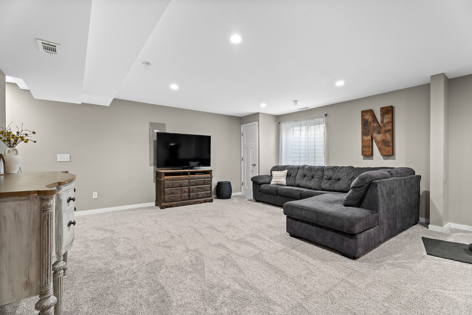 1053 Sears Circle Elburn, IL 60119 - Photo 22 of 31 a living room with furniture and a flat screen tv