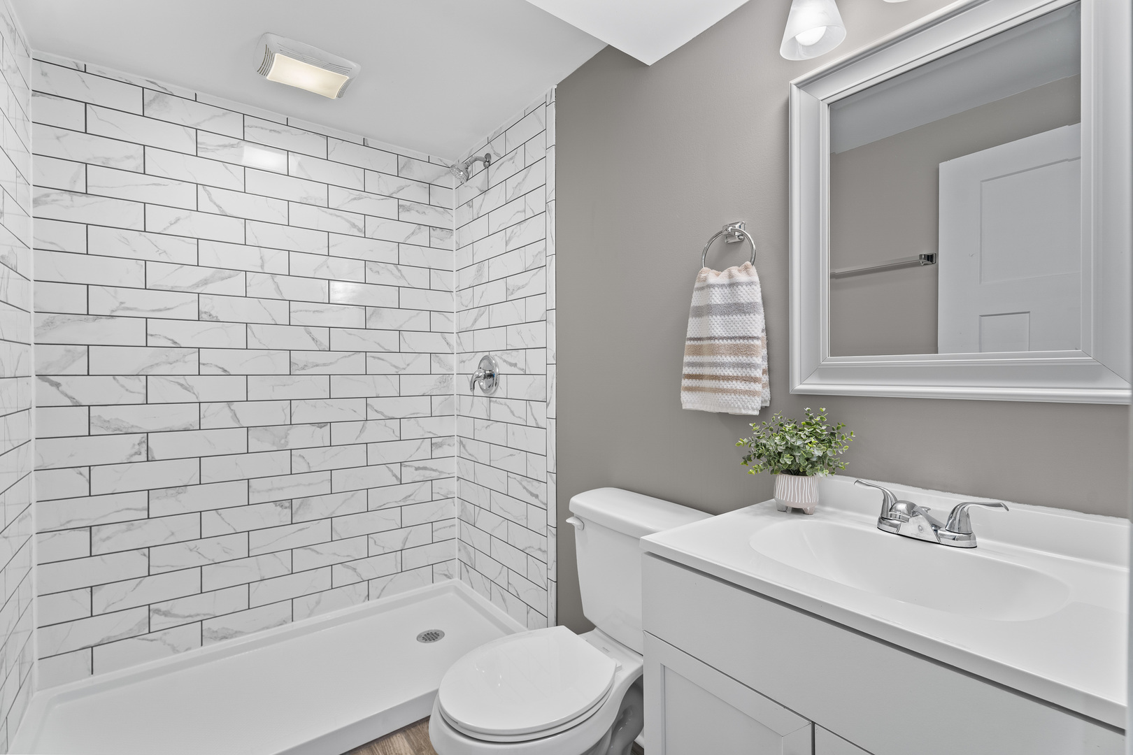 1053 Sears Circle Elburn, IL 60119 - Photo 23 of 31 a bathroom with a sink a toilet and shower