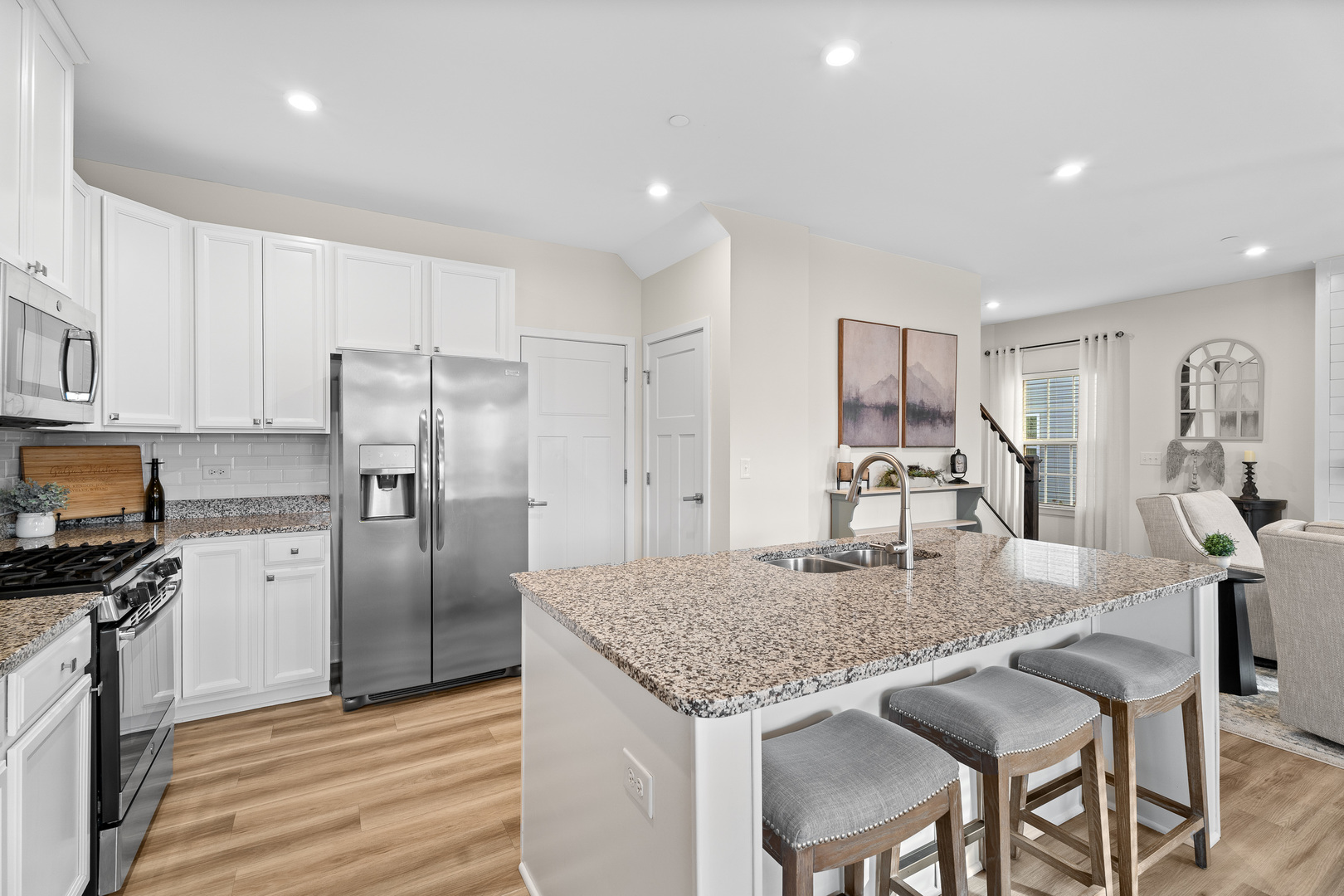 1053 Sears Circle Elburn, IL 60119 - Photo 4 of 31 a kitchen with granite countertop kitchen island cabinets and stainless steel appliances