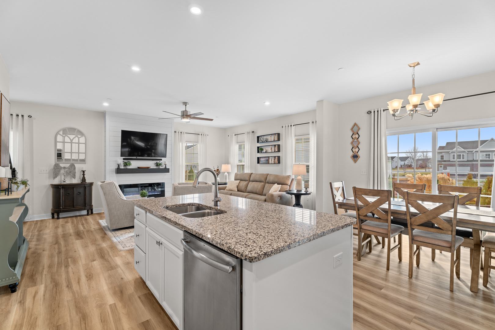 1053 Sears Circle Elburn, IL 60119 - Photo 5 of 31 a kitchen with granite countertop kitchen island stainless steel appliances a table and chairs