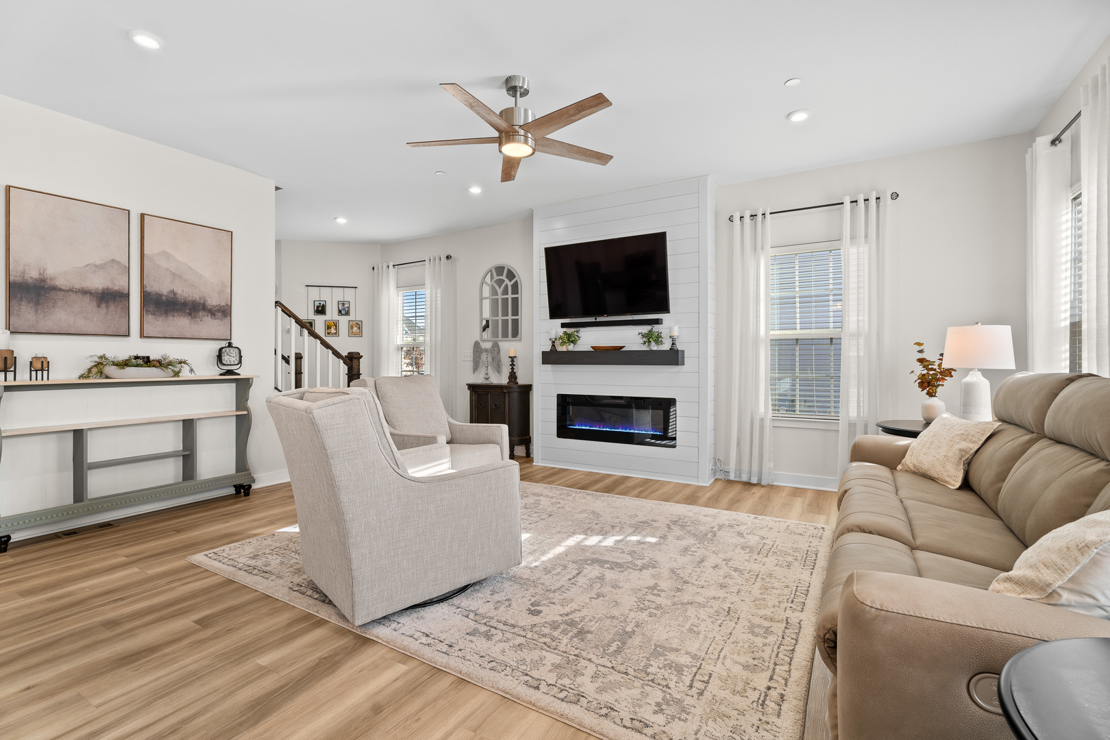1053 Sears Circle Elburn, IL 60119 - Photo 6 of 31 a living room with furniture a flat screen tv and a fireplace