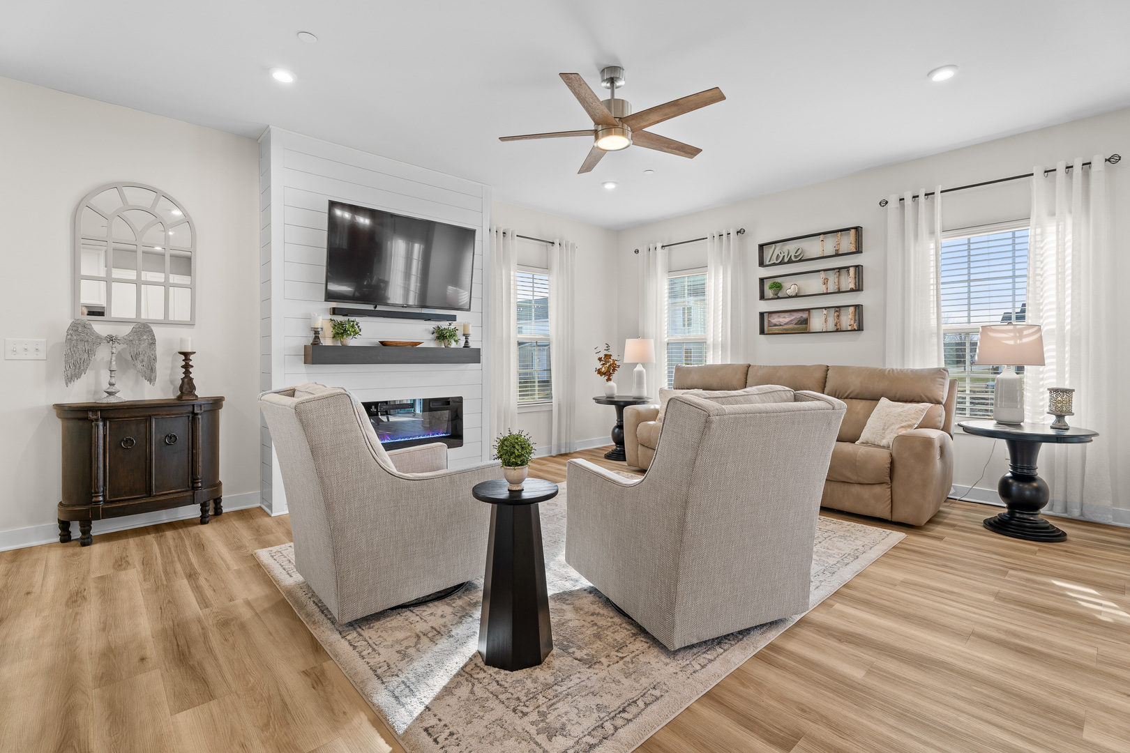 1053 Sears Circle Elburn, IL 60119 - Photo 7 of 31 a living room with furniture a flat screen tv and a fireplace
