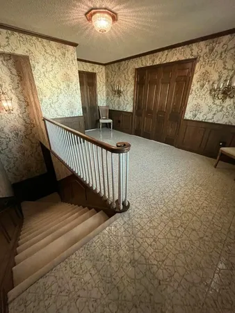 a view of a livingroom with furniture and a fireplace