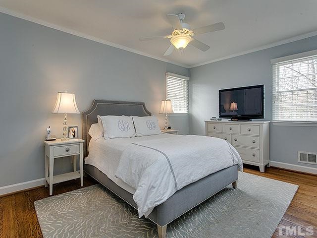 609 Ortega Road Raleigh, NC 27609 - Photo 19 of 25 a bedroom with bed tv and window